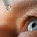 Patient with dry eye disease using eye drops